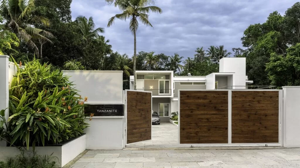 Green double couch with wooden legs